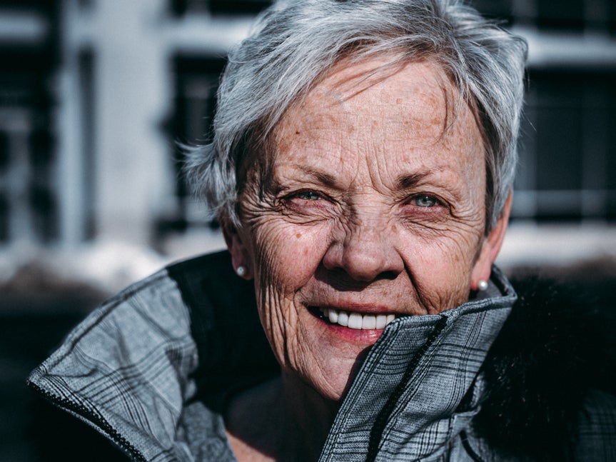 portrait of a woman wearing a jacket and smiling