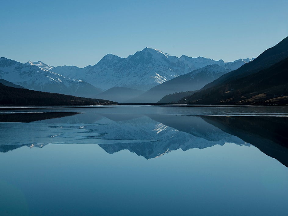 blue water and mountain landscape at dawn