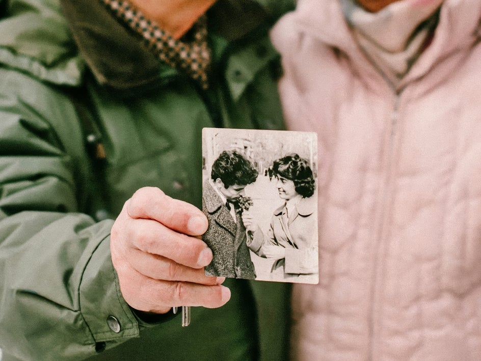 old couple with vintage photo