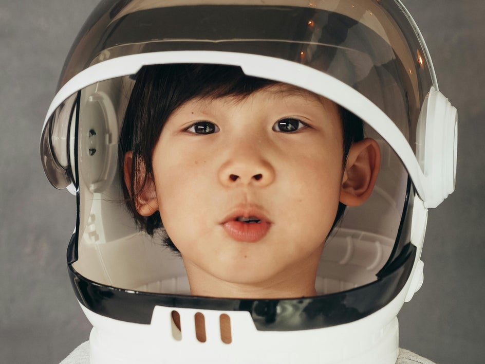 kid in astronaut helmet