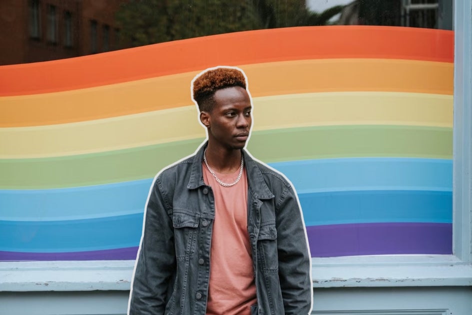 portrait of man in front of rainbow window with white outline