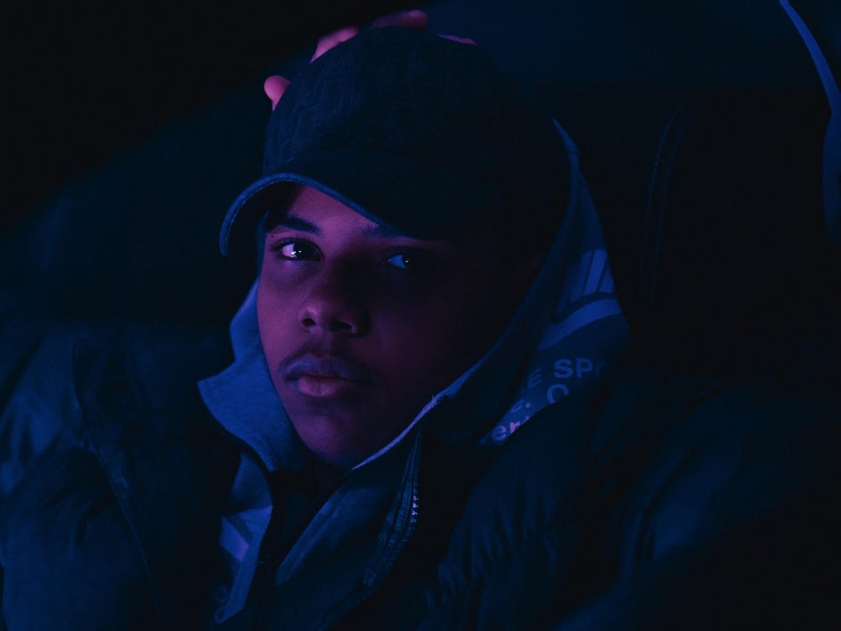 dark photo of man with hat