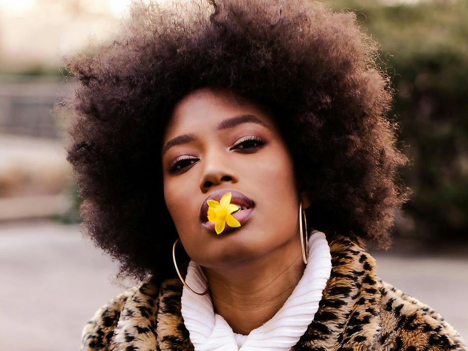 before: female portrait with afro hairstyle and flower