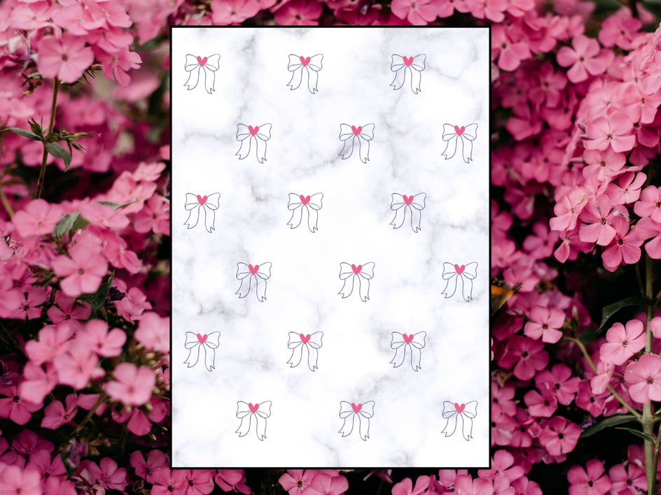 floral background with kindle insert that features bows and hearts on marble background