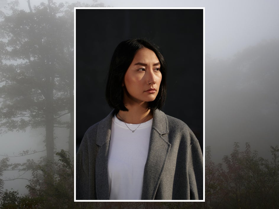 before: female portrait with grey forest background